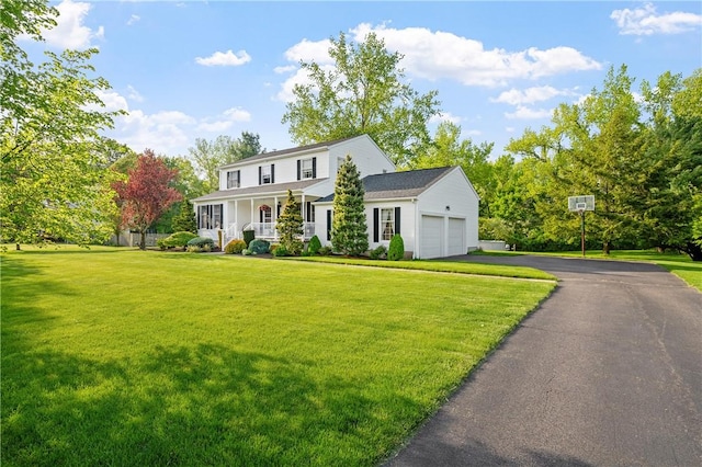 22 Linda Ln, South Windsor, CT 06074 - view of front of property with covered porch, a garage, a front lawn, and asphalt driveway