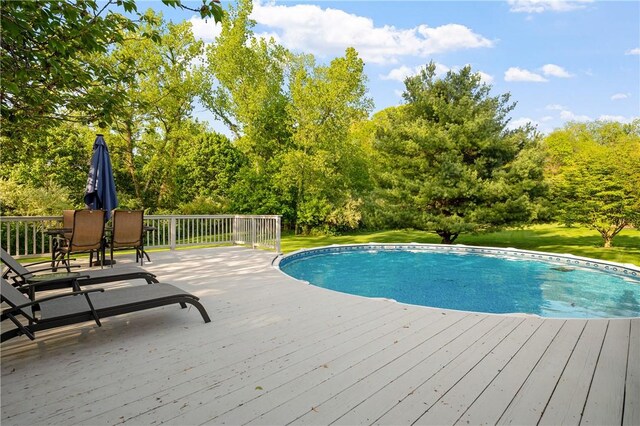 22 Linda Ln, South Windsor, CT 06074 - swimming pool featuring a wooden deck, a yard, and view of scattered trees