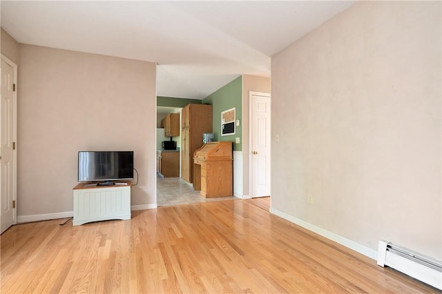 22 Linda Ln, South Windsor, CT 06074 - unfurnished living room with baseboard heating, light wood-style floors, and baseboards