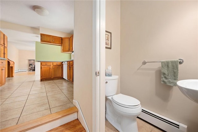 22 Linda Ln, South Windsor, CT 06074 - half bathroom with baseboard heating, toilet, and tile patterned flooring