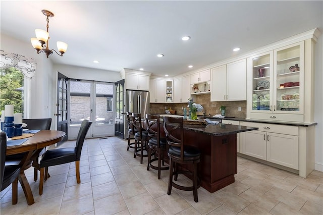 136 White Birch Cir, Scituate, RI 02831 - kitchen with plenty of natural light, a kitchen bar, backsplash, a chandelier, and recessed lighting