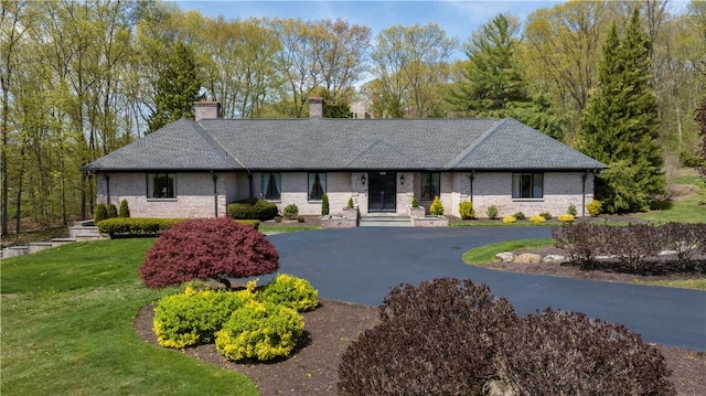 136 White Birch Cir, Scituate, RI 02831 - view of front of property featuring a chimney, a front lawn, asphalt driveway, and brick siding