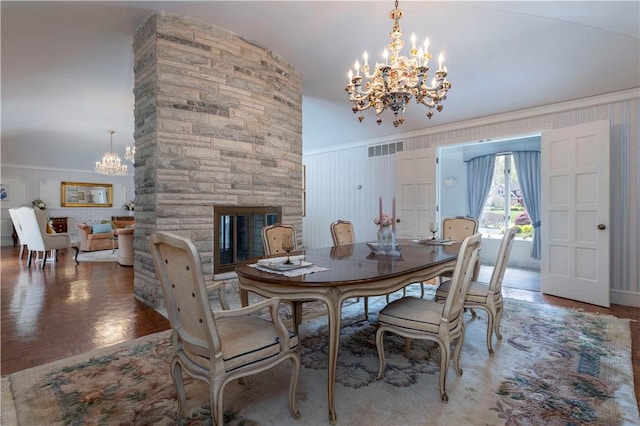 136 White Birch Cir, Scituate, RI 02831 - dining space featuring a chandelier, a fireplace, and ornamental molding