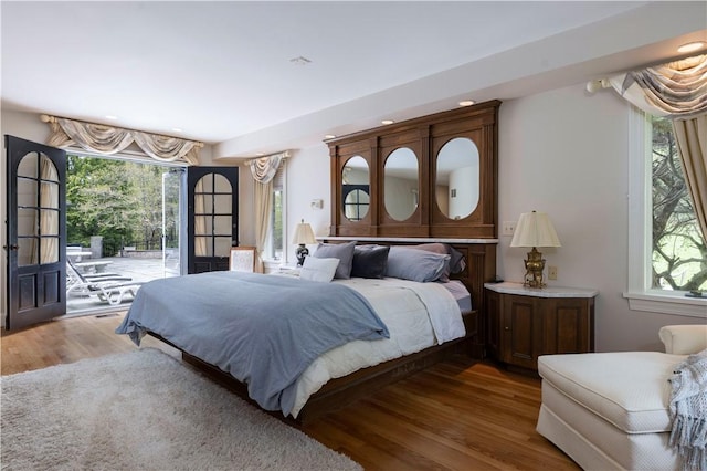 136 White Birch Cir, Scituate, RI 02831 - bedroom with access to outside, multiple windows, wood finished floors, and recessed lighting