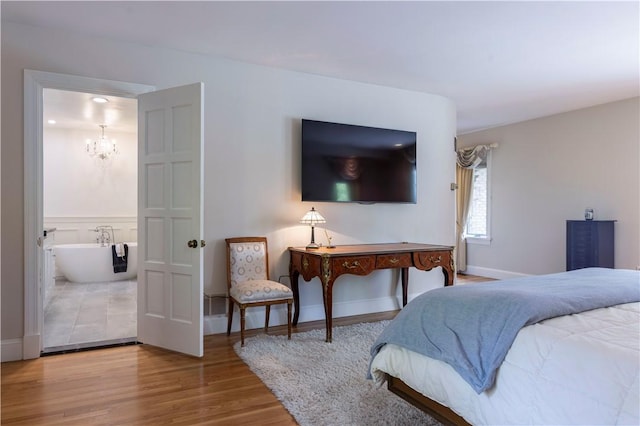 136 White Birch Cir, Scituate, RI 02831 - bedroom featuring a chandelier, wood finished floors, connected bathroom, and baseboards