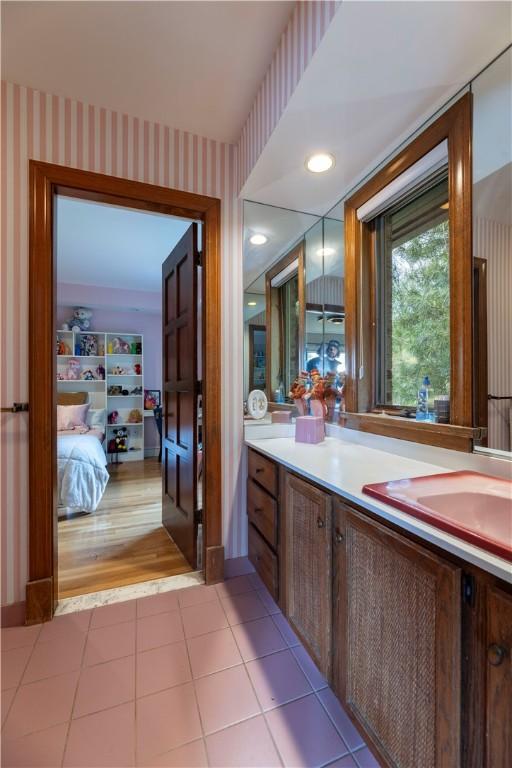 136 White Birch Cir, Scituate, RI 02831 - bathroom featuring vanity, wallpapered walls, tile patterned floors, and connected bathroom
