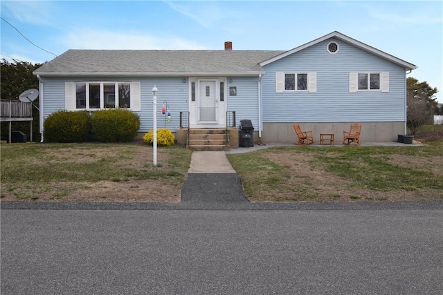 151 E Shore Rd, Narragansett, RI 02882 - view of front of home featuring a chimney, a front lawn, and roof with shingles