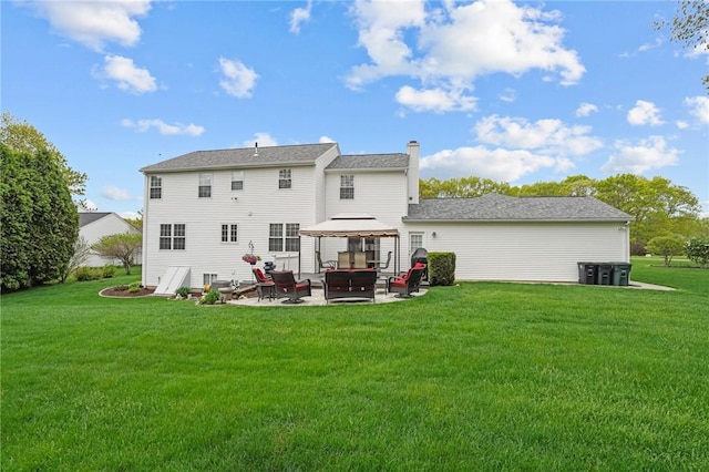 14 Ginger Trl, Coventry, RI 02816 - back of property with a gazebo, a patio area, a lawn, and a chimney
