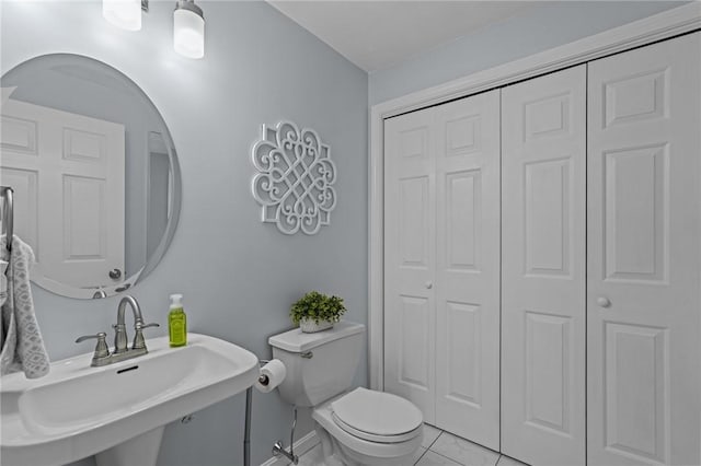 14 Ginger Trl, Coventry, RI 02816 - bathroom with a closet, a sink, toilet, and baseboards