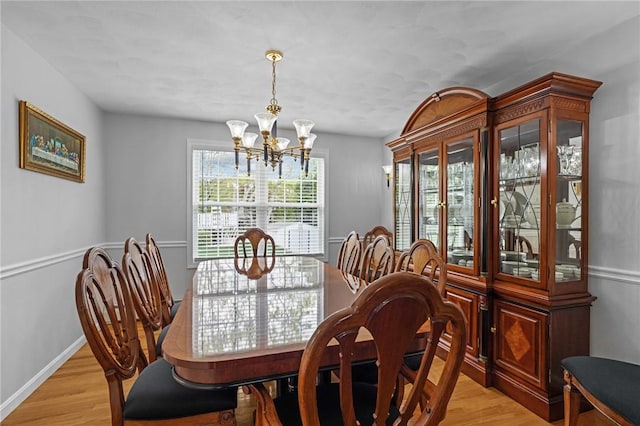 14 Ginger Trl, Coventry, RI 02816 - dining room with a chandelier, light wood finished floors, and baseboards