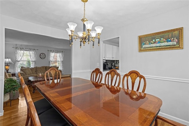 14 Ginger Trl, Coventry, RI 02816 - dining room featuring a chandelier, wood finished floors, and baseboards
