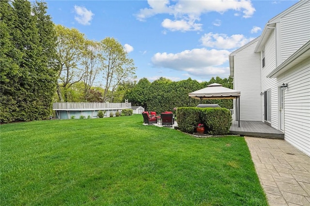 14 Ginger Trl, Coventry, RI 02816 - view of green lawn with a gazebo, a deck, an outdoor hangout area, and a patio