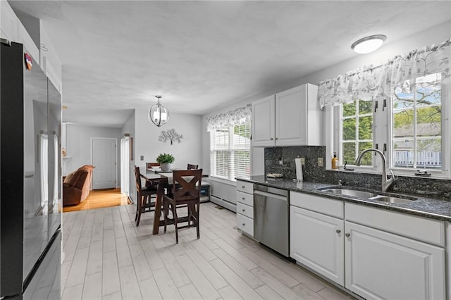14 Ginger Trl, Coventry, RI 02816 - kitchen featuring stainless steel appliances, a sink, healthy amount of natural light, and a baseboard radiator
