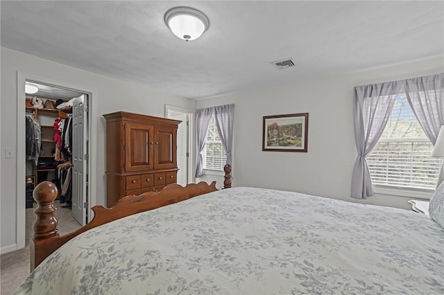 14 Ginger Trl, Coventry, RI 02816 - bedroom with a walk in closet, carpet, and a closet