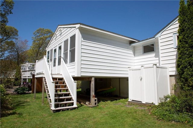 88 Old Post Rd Unit 10, Westerly, RI 02891 - view of home's exterior featuring stairway, a lawn, and a wooden deck