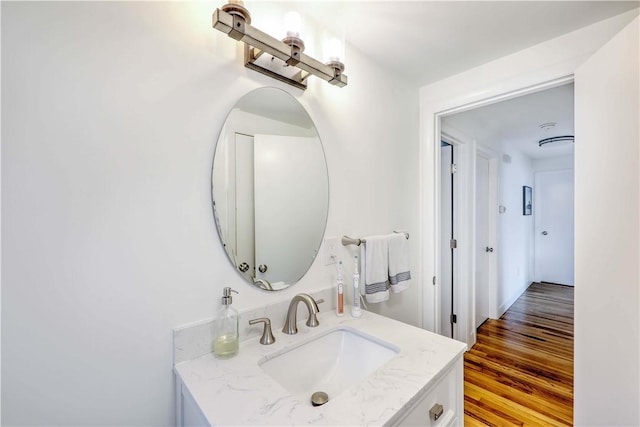 bathroom featuring wood finished floors and vanity