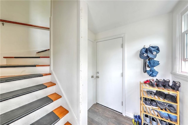 stairs with wood finished floors