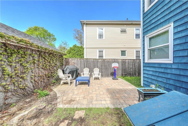 view of patio featuring a fenced backyard and grilling area