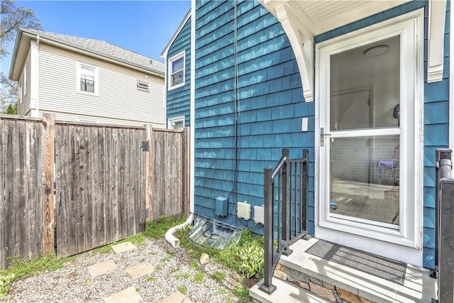 view of side of home with fence