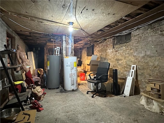unfinished below grade area with water heater and gas water heater
