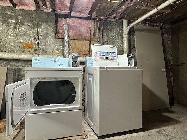 clothes washing area featuring washing machine and dryer