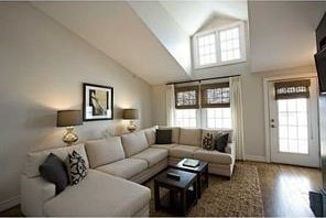 44 Bay St Unit B105/B205, Westerly, RI 02891 - living room with wood finished floors, high vaulted ceiling, and baseboards