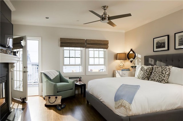 44 Bay St Unit B105/B205, Westerly, RI 02891 - bedroom with wood finished floors, a glass covered fireplace, crown molding, and a ceiling fan