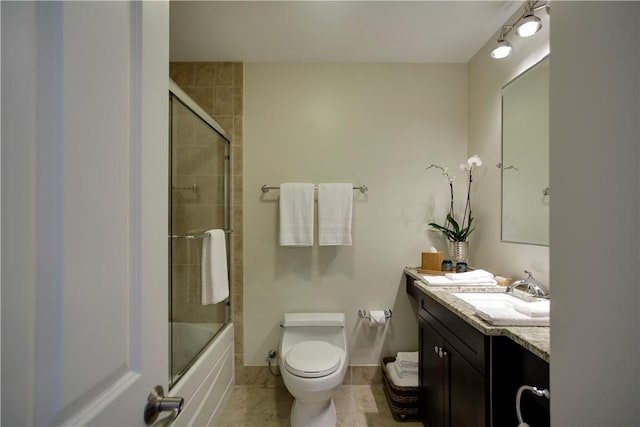 44 Bay St Unit B105/B205, Westerly, RI 02891 - full bath with toilet, vanity, tile patterned floors, shower / bath combination with glass door, and baseboards