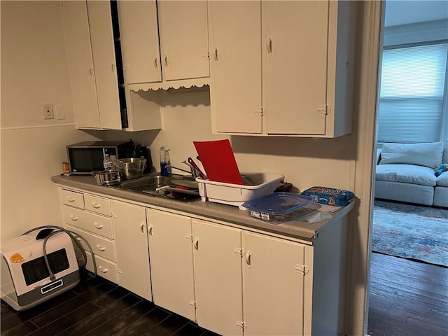 243 Transit St, Woonsocket, RI 02895 - kitchen featuring dark wood-type flooring and white cabinets