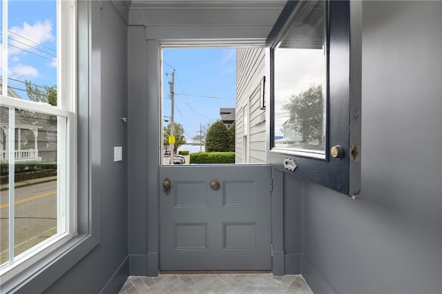 104 Second St, Newport, RI 02840 - entryway featuring plenty of natural light, baseboards, and brick patterned flooring