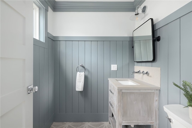 104 Second St, Newport, RI 02840 - half bathroom with vanity, toilet, and wainscoting