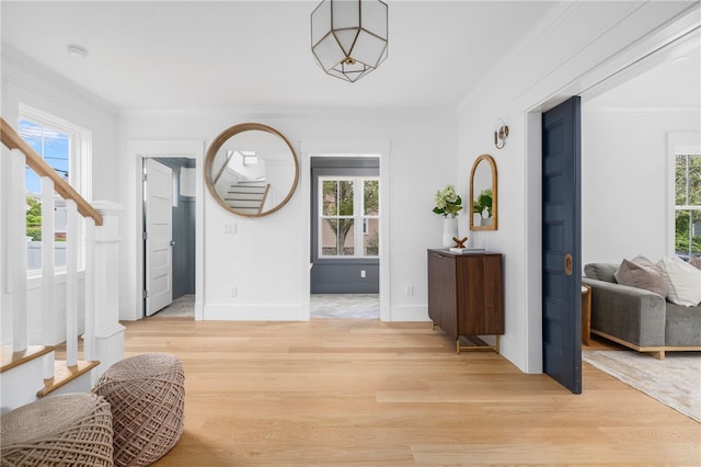 104 Second St, Newport, RI 02840 - entrance foyer featuring light wood-type flooring, stairs, ornamental molding, and baseboards