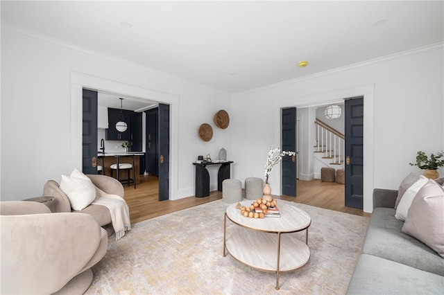 104 Second St, Newport, RI 02840 - living area featuring stairs, light wood finished floors, ornamental molding, and baseboards