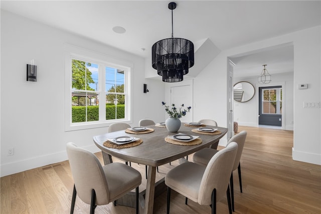 104 Second St, Newport, RI 02840 - dining area featuring a chandelier, baseboards, and light wood finished floors
