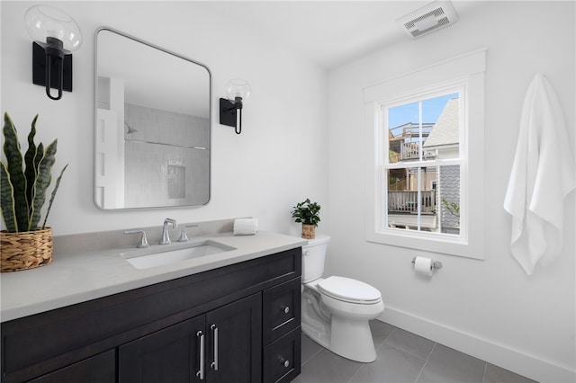 104 Second St, Newport, RI 02840 - bathroom featuring vanity, toilet, a shower, tile patterned flooring, and baseboards