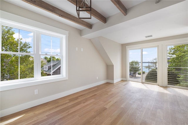 104 Second St, Newport, RI 02840 - additional living space featuring healthy amount of natural light, baseboards, beamed ceiling, and light wood-style flooring