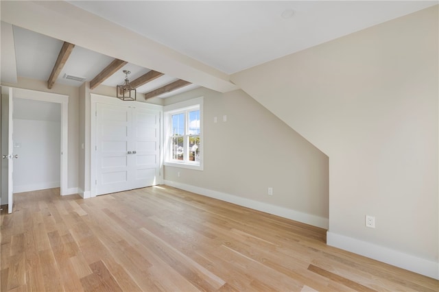 104 Second St, Newport, RI 02840 - bonus room with a chandelier, baseboards, light wood-style flooring, and beamed ceiling