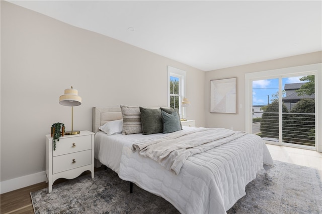 104 Second St, Newport, RI 02840 - bedroom with access to outside, multiple windows, baseboards, and wood finished floors