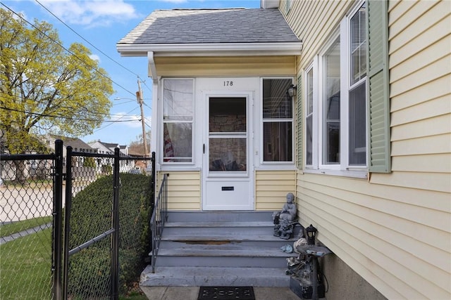 178 Gould Ave, Warwick, RI 02888 - view of exterior entry featuring a shingled roof, fence, and a gate
