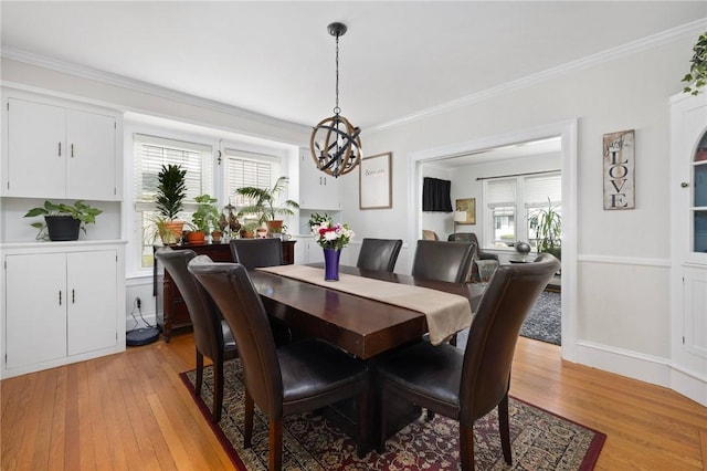 178 Gould Ave, Warwick, RI 02888 - dining room featuring a chandelier, plenty of natural light, light wood-type flooring, and crown molding
