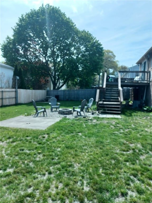 59 Columbus Ave, North Providence, RI 02911 - view of yard featuring a fire pit, stairway, a wooden deck, and a patio area