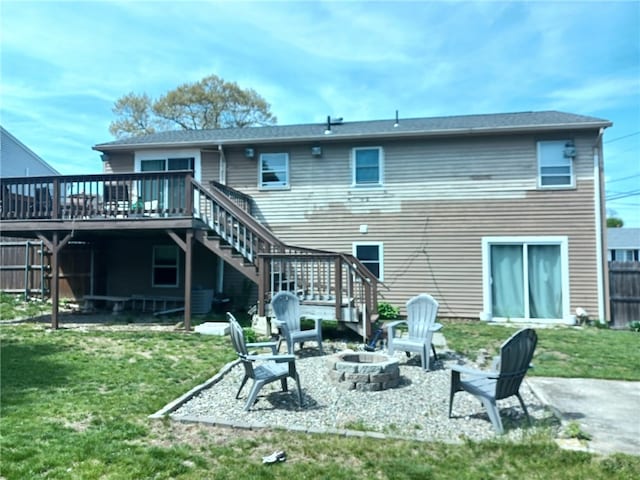 59 Columbus Ave, North Providence, RI 02911 - back of house featuring stairway, a fire pit, a wooden deck, and a patio area