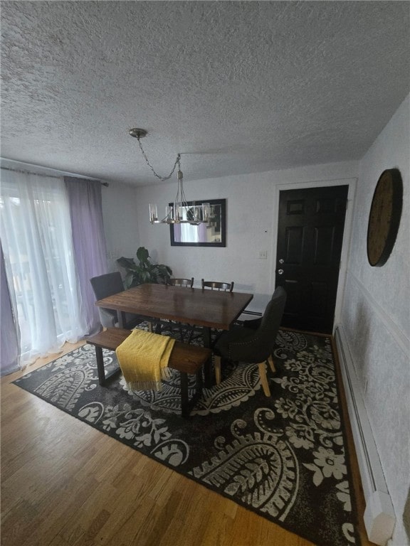 59 Columbus Ave, North Providence, RI 02911 - dining space featuring wood finished floors and a textured ceiling