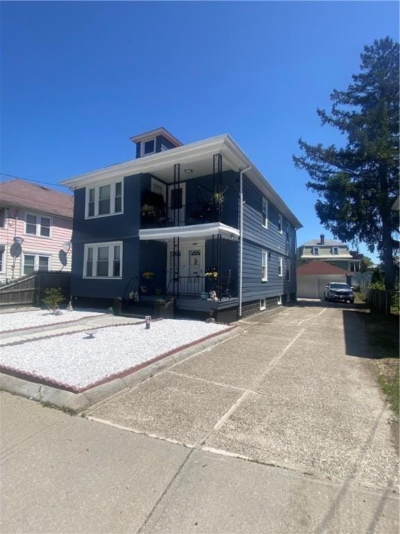 362 Webster Ave, Cranston, RI 02920 - view of front facade with a porch, fence, and a balcony