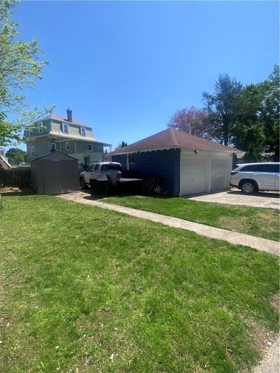 362 Webster Ave, Cranston, RI 02920 - view of side of home featuring an outbuilding and a storage shed