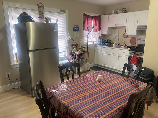 362 Webster Ave, Cranston, RI 02920 - dining space featuring light wood-style flooring and baseboards