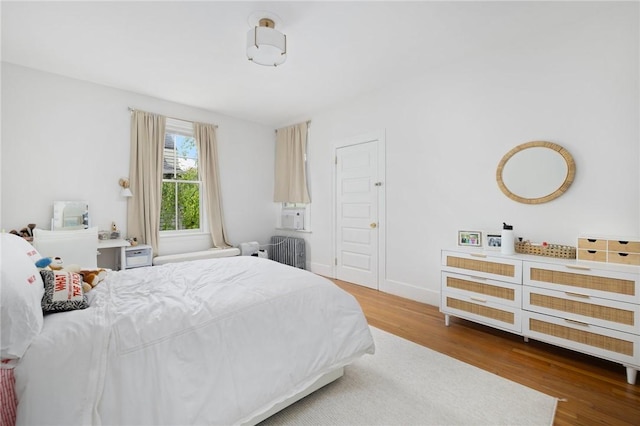 bedroom featuring wood finished floors