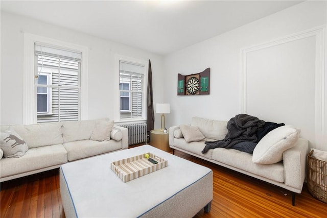 living room featuring radiator and wood-type flooring