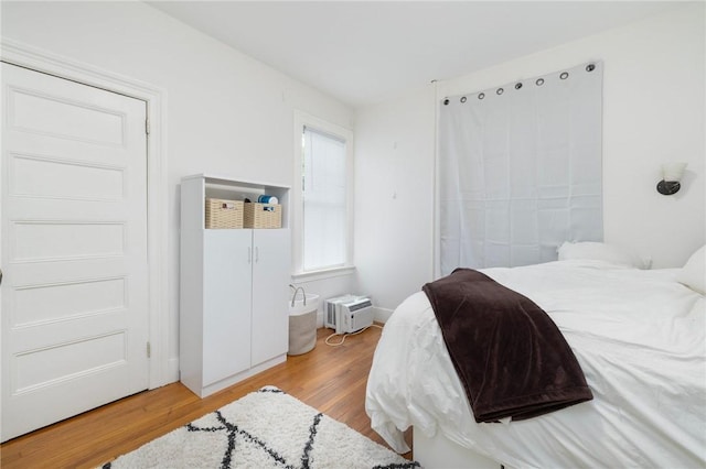 bedroom with wood finished floors