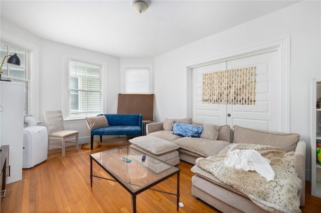 living area with hardwood / wood-style flooring